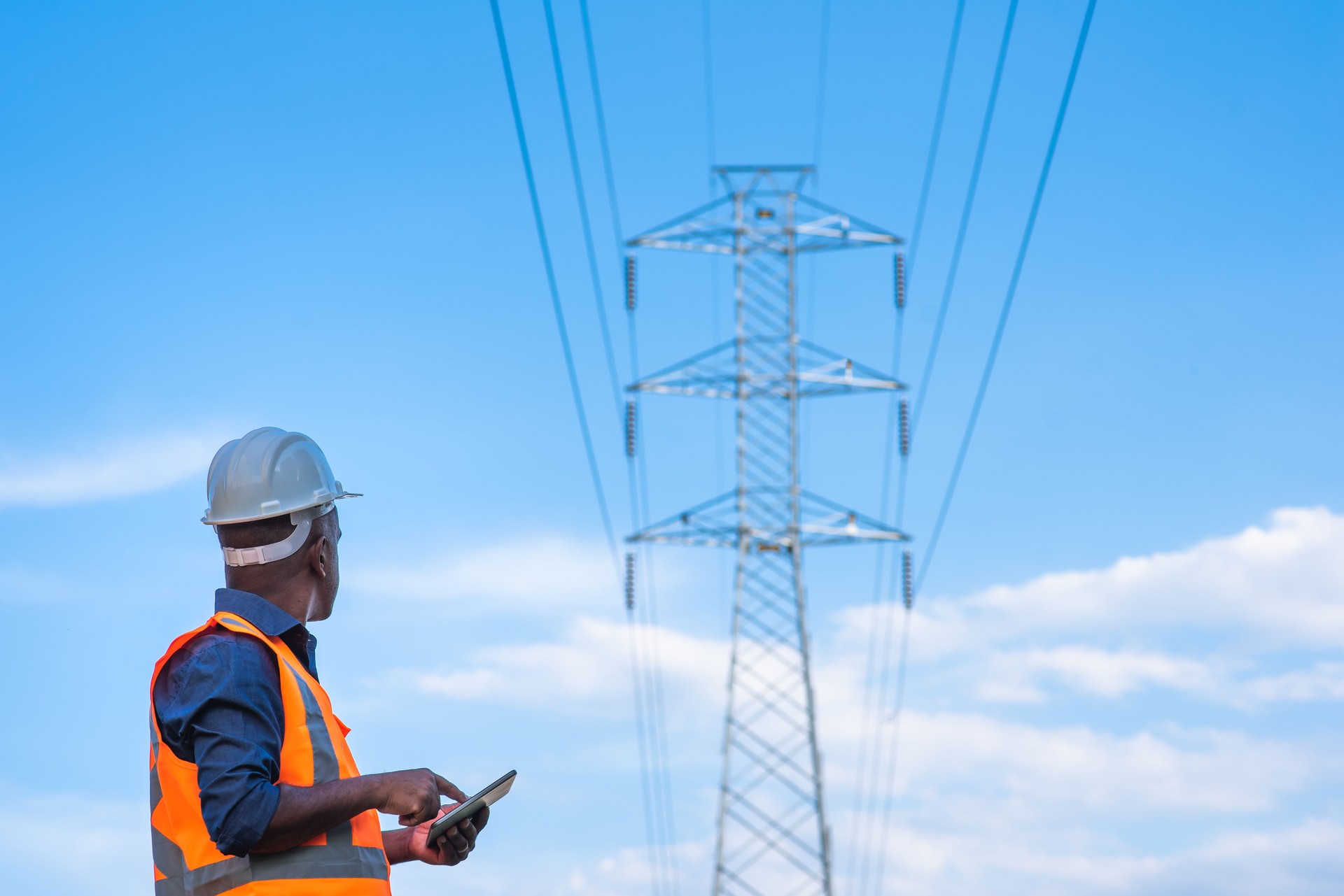 Men working with electricity, pylon